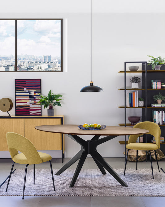 Mahalia dining chair in mustard with steel legs, with a black painted finish.