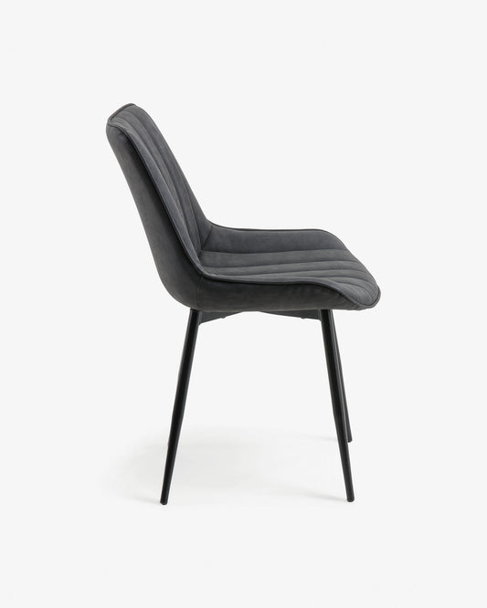 Janis faux leather chair in dark grey, with steel legs in a black finish.