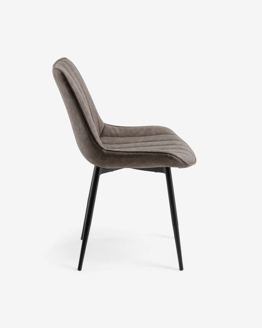 Janis faux leather chair in light grey, with steel legs in a black finish.