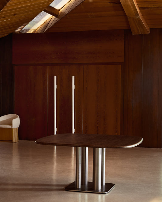 Melvar table made from walnut veneer and legs with brushed stainless steel base 150 x 150cm